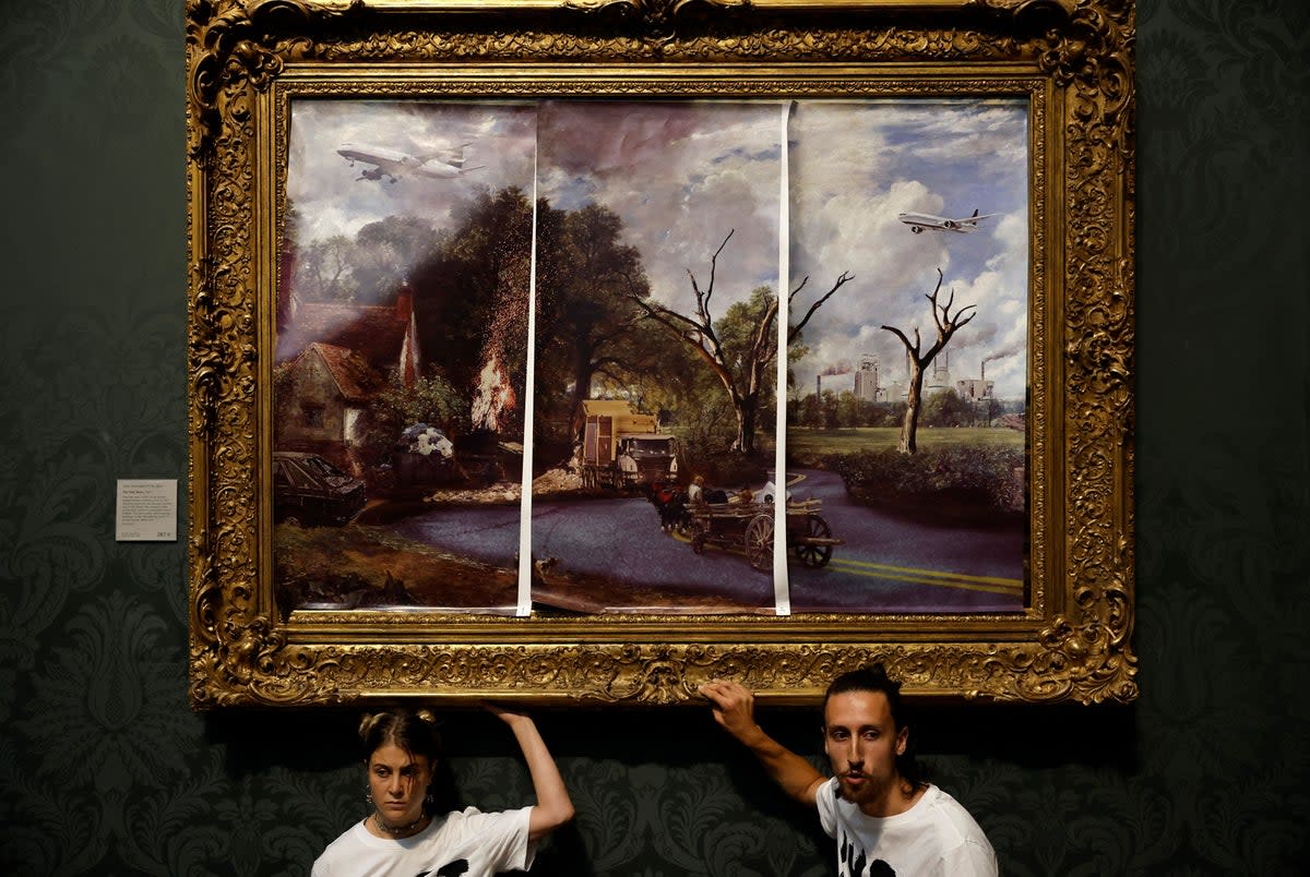 Activists from the ‘Just Stop Oil’ campaign group glued their hands to the frame of ‘The Hay Wain’ by John Constable (AFP via Getty Images)