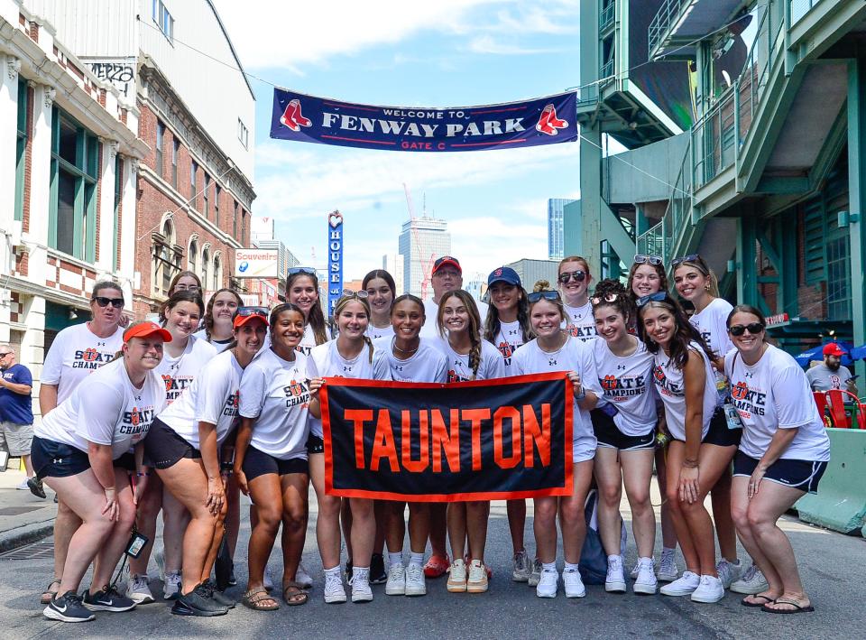 The Division 1 state champion Taunton High softball team poses for a photo before being honored at Saturday’s Red Sox game.