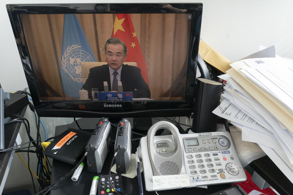 Chinese Foreign Minister Wang Yi is seen on a computer monitor at United Nations headquarters as he speaks during a virtual high-level meeting of the United Nations Security Council meeting on safeguarding international peace and security and global governance in the post-COVID-19 era happening during the 75th session of the United Nations General Assembly, Thursday, Sept. 24, 2020. (AP Photo/Mary Altaffer)