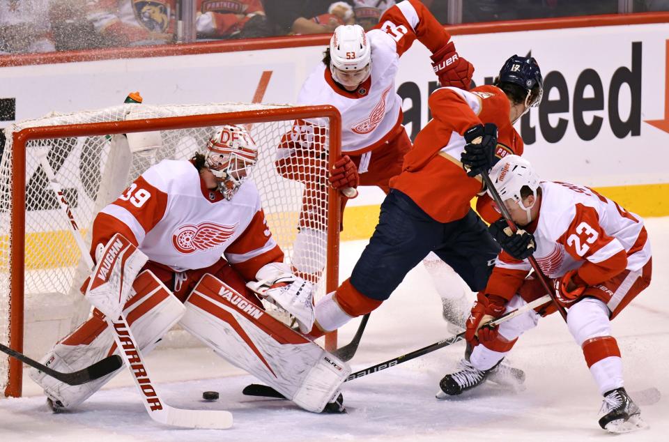 Florida Panthers left wing Mason Marchment scores a goal in the first period past Detroit Red Wings goaltender Alex Nedeljkovic as defenseman Moritz Seider (53) and left wing Lucas Raymond (23) defend during the first period at FLA Live Arena, April 21, 2022.