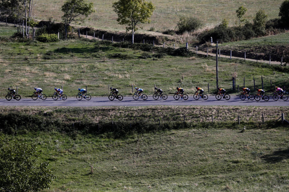 The pack rides during the 14th stage of the Tour de France cycling race over 194 kilometers (120,5 miles) with start in Clermont-Ferrand and finish in Lyon, France, Saturday, Sept. 12, 2020. (AP Photo/Thibault Camus)