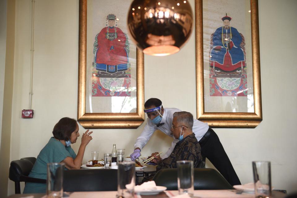 KOLKATA, INDIA - JUNE 8: Customers sitting for a meal at BarBQ restaurant as it opens after lockdown relaxations at Park Street, on June 8, 2020 in Kolkata, India. (Photo by Samir Jana/Hindustan Times via Getty Images)