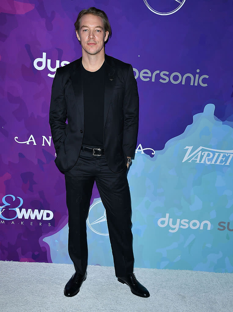 Diplo keeping things casual in a suit and T-shirt