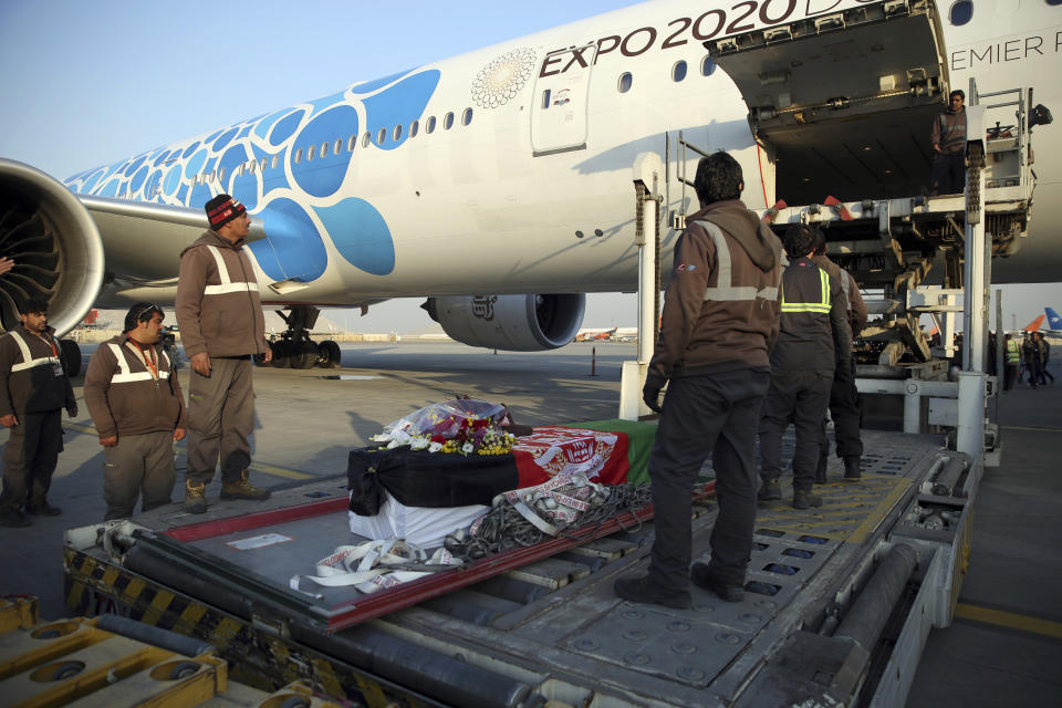 The coffin of Japanese physician Tetsu Nakamura is loaded into a plane after a ceremony at the Hamid Karzai International Airport in Kabul, Afghanistan, Saturday, Dec. 7, 2019. Nakamura was killed earlier this week in a roadside shooting in eastern Afghanistan. (AP Photo/Rahmat Gul)