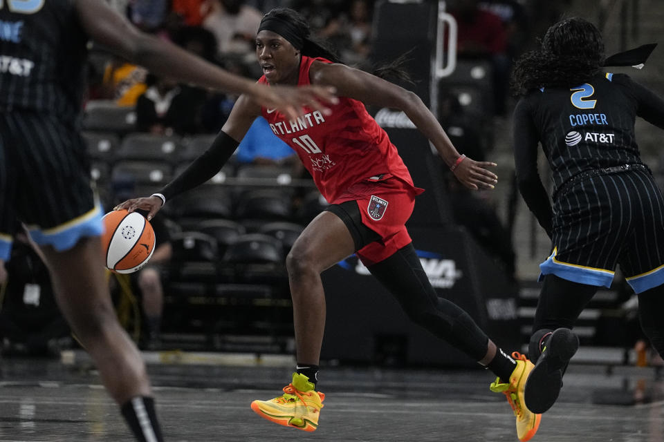 Atlanta Dream guard Rhyne Howard (10) works against the Chicago Sky during a WNBA basketball game, Tuesday, May 30, 2023, in College Park, Ga. The Atlanta Dream's hopes for moving up in the WNBA rest heavily on second-year player Rhyne Howard, the 2022 No. 1 overall pick who did not disappoint as an All-Star and Rookie of the Year. (AP Photo/John Bazemore)