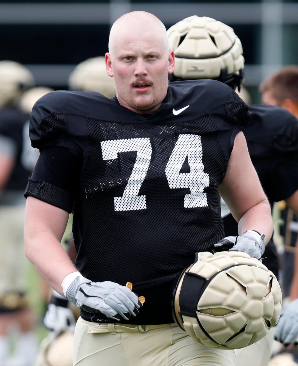 Purdue Boilermakers offensive lineman Eric Miller (74) gets ready for a drill during a practice, Tuesday, Aug. 9, 2022, at Purdue University in West Lafayette, Ind. 