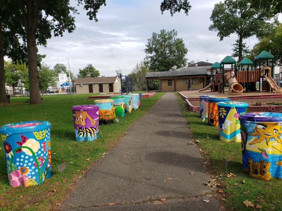 Painted rain barrels in Carver Park in Hackensack.