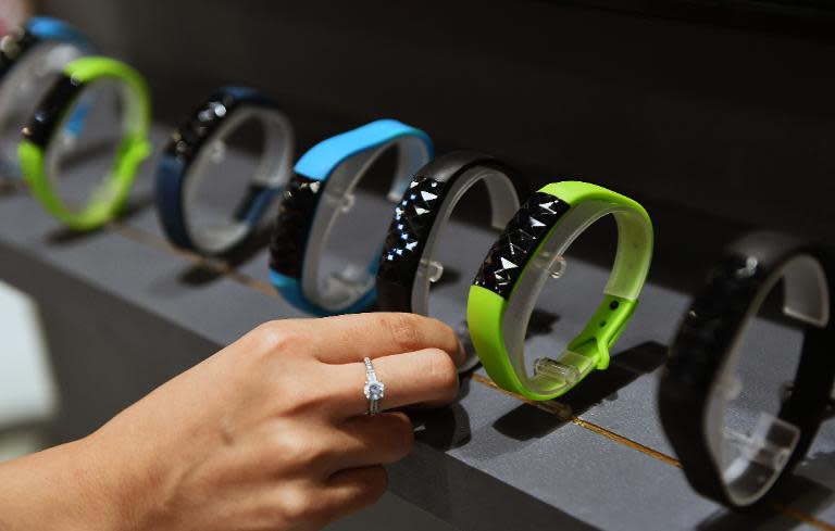 A visitor looks at smart watches designed by Taiwan's Oaxis during the Computex trade show in Taipei, June 2, 2015