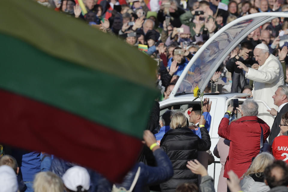 Pope Francis arrives in his pope-mobile to celebrate an open-air Mass at Santakos Park, in Kaunas, Lithuania, Sunday, Sept. 23, 2018. Francis is paying tribute to Lithuanians who suffered and died during Soviet and Nazi occupations on the day the country remembers the near-extermination of its centuries-old Jewish community during the Holocaust. (AP Photo/Andrew Medichini)