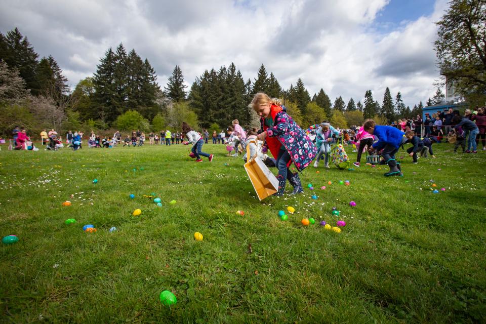 Children take to the fields at Lively Park to search for Easter eggs during the MEGGA Hunt on April 16.