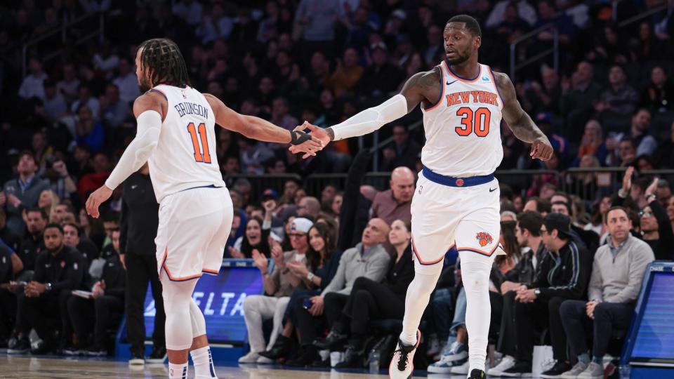 Nov 30, 2023; New York, New York, USA; New York Knicks forward Julius Randle (30) slaps hands with guard Jalen Brunson (11) after a basket during the second half against the Detroit Pistons at Madison Square Garden.
