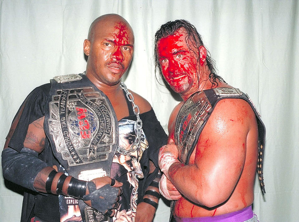 John Kronus (right) and New Jack after winning the ECW Tag Team Titles circa 1998