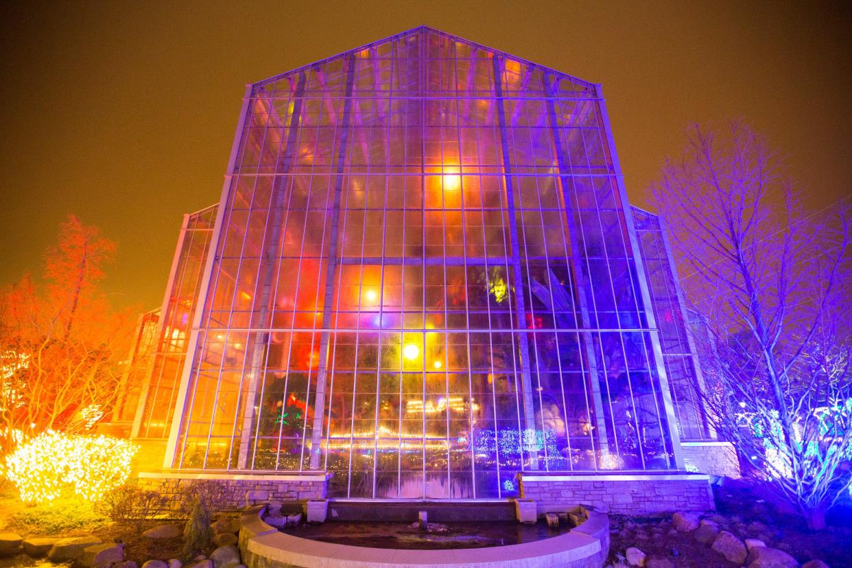 Colorful lights of the All Aglow exhibit illuminate the landscape on Thursday, Dec. 13, 2018, at Nicholas Conservatory & Gardens in Rockford.