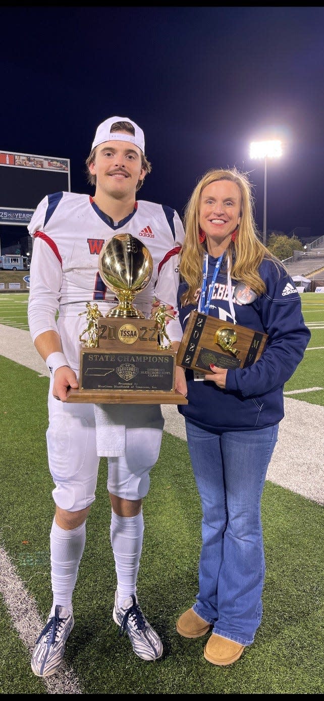 West High quarterback Carson Jessie and his mother, principal Ashley Speas, have a great night Dec. 2 as the Rebels win the Class 5A state championship and he is named the BlueCross Bowl MVP.