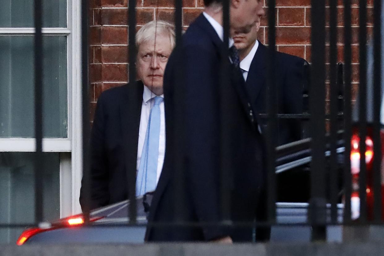 Britain's Prime Minister Boris Johnson leaves from the rear of 10 Downing Street in central London on October 16: AFP via Getty Images