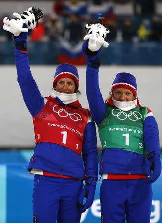 Cross-Country Skiing - Pyeongchang 2018 Winter Olympics - Women's Team Sprint Free Finals - Alpensia Cross-Country Skiing Centre - Pyeongchang, South Korea - February 21, 2018 - Marit Bjoergen and Maiken Caspersen Falla of Norway celebrate bromze. REUTERS/Dominic Ebenbichler