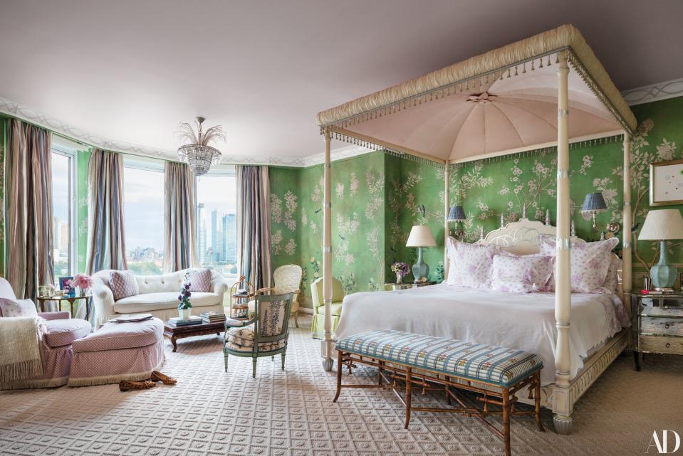 The master bedroom is swathed in a Gracie wallpaper; Buatta designed the bed.