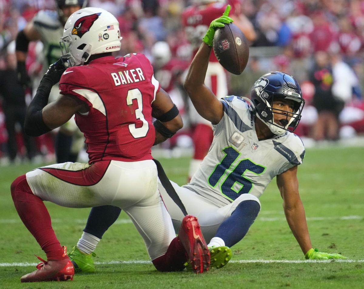 DK Metcalf of the Seattle Seahawks reacts after diving to make a