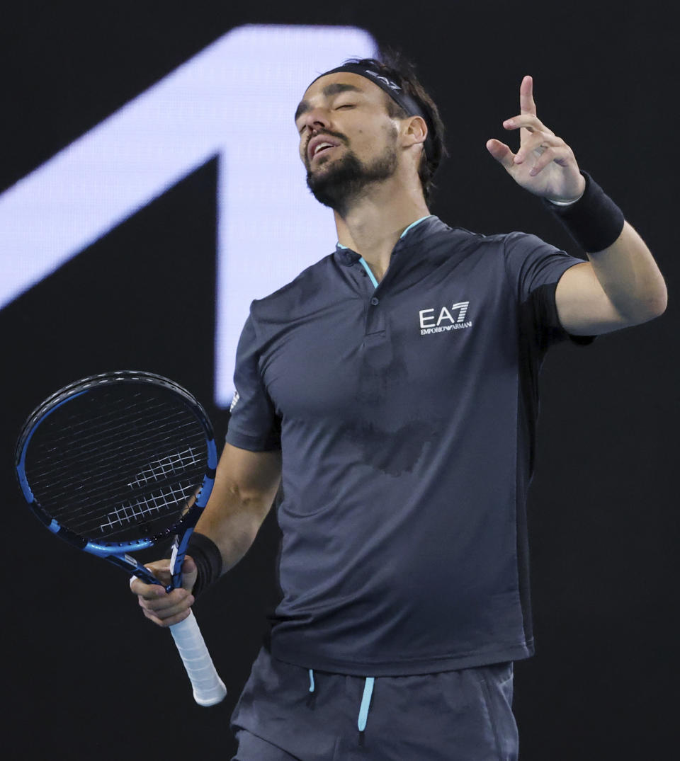 Italy's Fabio Fognini reacts while playing against Australia's Alex De Minaur during their third round match at the Australian Open tennis championships in Melbourne, Australia, Saturday, Feb. 13, 2021. (AP Photo/Hamish Blair)