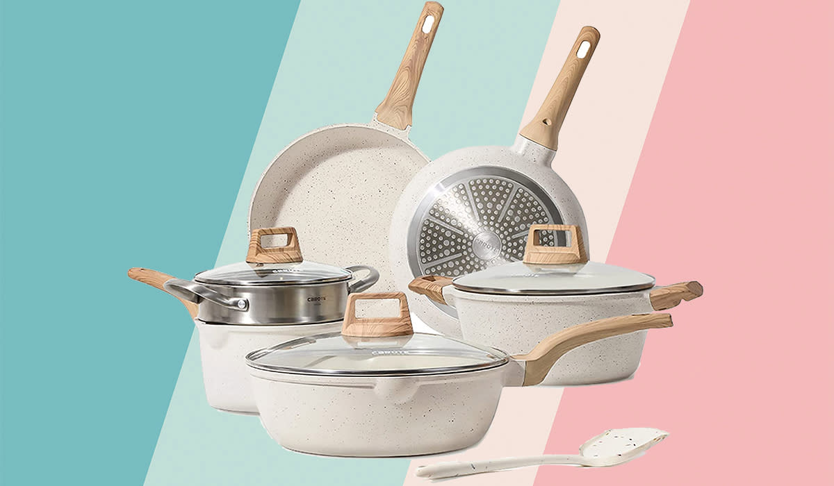 A white granite cookware 10-piece set on a pastel background