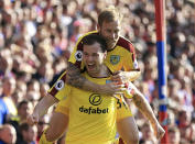 <p>Burnley’s Ashley Barnes, foreground, celebrates scoring his side’s first goal with teammate Scott Arfield during the English Premier League soccer match between Crystal Palace and Burnley, at Selhurst Park, in London, Saturday April 29, 2017. (Nigel French/PA via AP) </p>