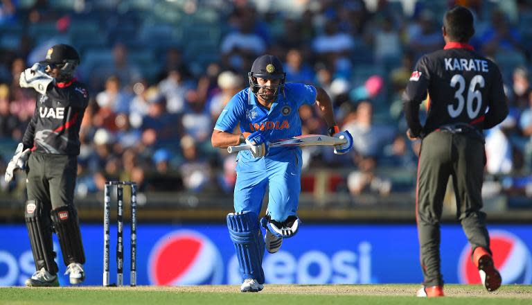 India's Rohit Sharma (C) made 57 and Virat Kohli hit 33 to take India past their 103-run target after just 18.5 overs at Perth's WACA ground