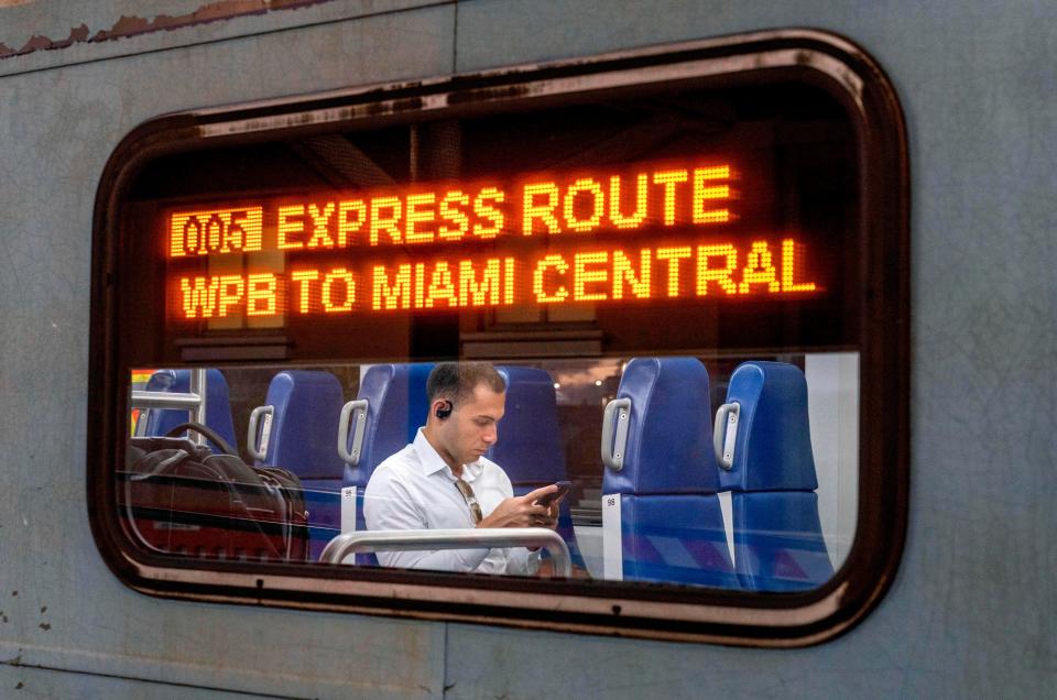 A passenger waits for the Tri-Rail Express train to leave for Miami from West Palm Beach, Florida on July 1, 2024. For $17.50, passengers can take the 90 minute ride to Miami with only 5 stops.
