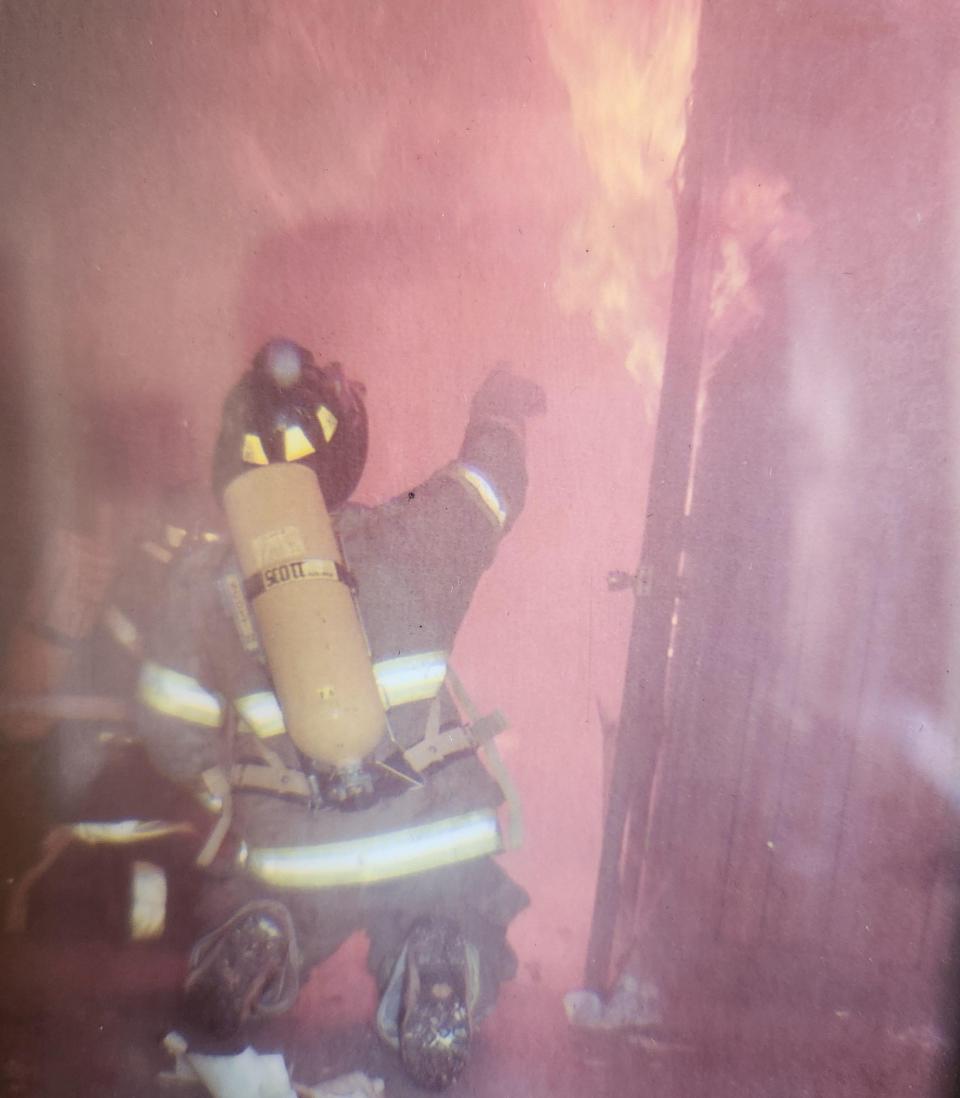 Firefighter Danny Kuhlmann battles a fire.