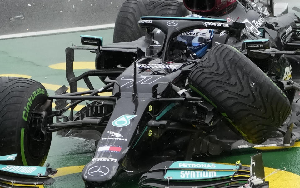 Mercedes driver Valtteri Bottas of Finland steers his car out of the track after he crashed during the Hungarian Formula One Grand Prix at the Hungaroring racetrack in Mogyorod, Hungary, Sunday, Aug. 1, 2021. (AP Photo/Darko Bandic)