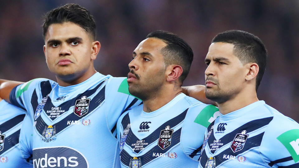 Latrell Mitchell, Josh Addo-Carr and Cody Walker have stood together for the national anthem. Pic: Getty