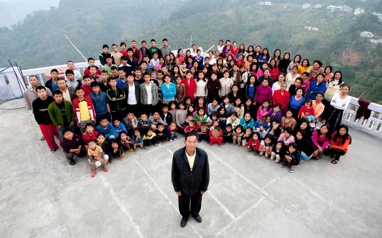 A family photograph of the Ziona family, with a total of 181 members. Ziona Chana, 67, is at the front - Barcroft Media 