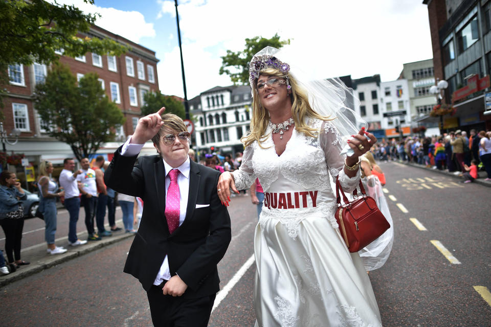 <p>A drag queen and a participant dressed as Donald Trump wave to the crowd as Belfast Gay Pride takes place on Aug. 5, 2017 in Belfast, Northern Ireland. (Photo: Charles McQuillan/Getty Images) </p>