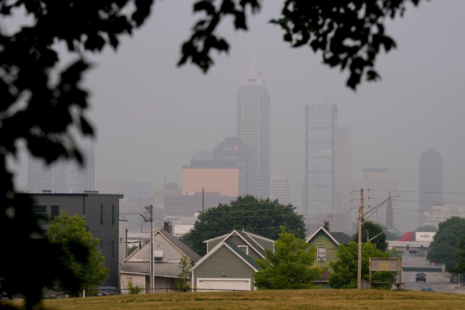 A thick haze caused by Canadian wildfire smoke obscures the view of downtown Indianapolis on Wednesday, June 28, 2023, as seen from Highland Park on the city's east side.