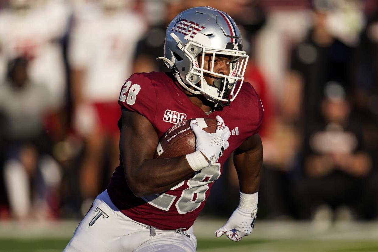 Troy running back Kimani Vidal (28) runs against the Louisiana-Lafayette.