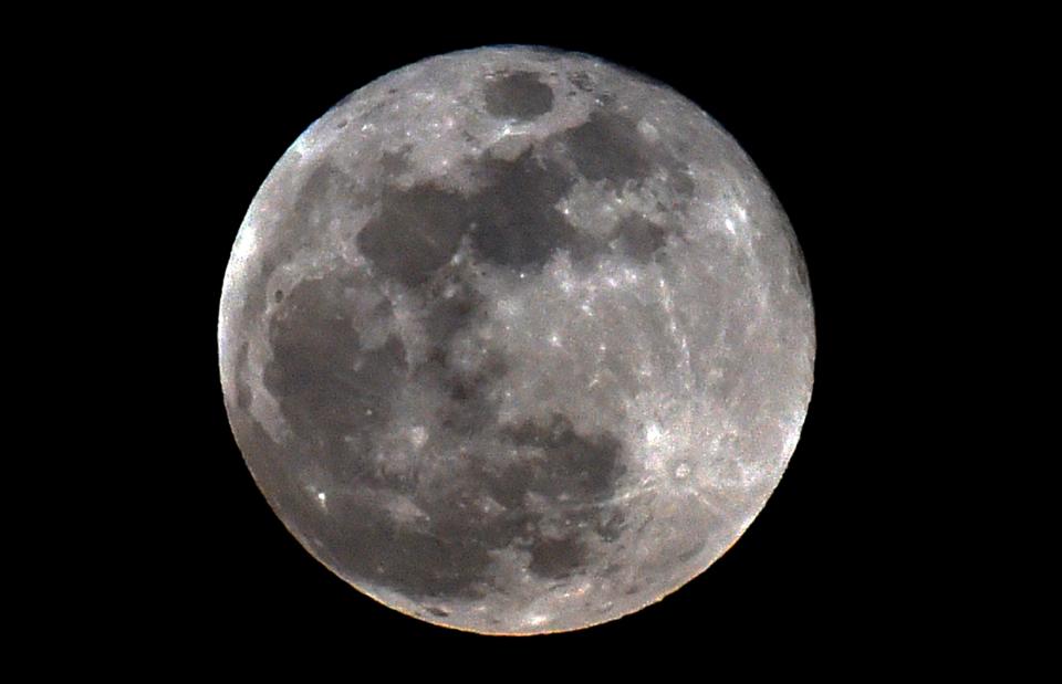 The full moon is seen during a penumbral lunar eclipse in Mexico City on June 5, 2020. A penumbral lunar eclipse will occur over the Americas during the overnight of July 4-5, 2020.