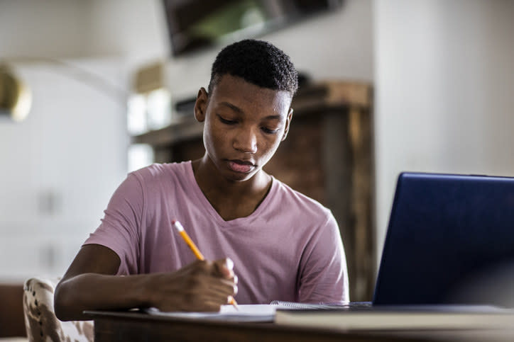 teen doing homework