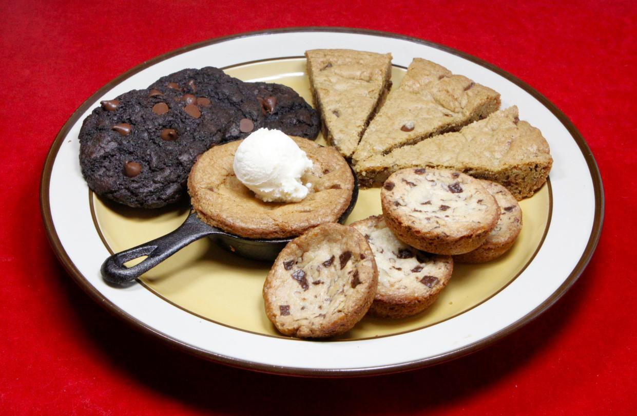 This week's featured cookies include, top left, Chewy Double Chocolate Chip Cookies; bottom right, Caramel Crunch-Chocolate Chunklet Cookies; middle, a mini Chocolate Chip Skillet Cookie topped with a scoop of ice cream; and top right, Chocolate Chip Skillet Cookie wedges cut from a larger skillet.