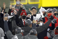 Tampa Bay Buccaneers quarterback Tom Brady celebrates with his teammates after winning the NFC championship NFL football game against the Green Bay Packers in Green Bay, Wis., Sunday, Jan. 24, 2021. The Buccaneers defeated the Packers 31-26 to advance to the Super Bowl. (AP Photo/Jeffrey Phelps)