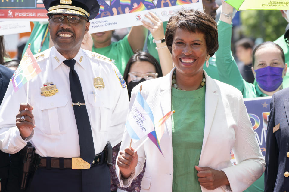 District of Columbia Mayor Muriel Bowser, right, attends a news conference ahead of DC Pride events with Metropolitan Police Chief Robert Contee III, Friday, June 10, 2022, in Washington. Bowser is seeking a third term in office. (AP Photo/Jacquelyn Martin)