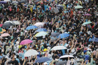 Pro-democracy protesters gather during a protest near a main train station in Bangkok, Thailand, Saturday, Oct. 17, 2020. The authorities in Bangkok shut down mass transit systems and set up roadblocks Saturday as Thailand's capital braced for a fourth straight day of determined anti-government protests. (AP Photo/Sakchai Lalit)