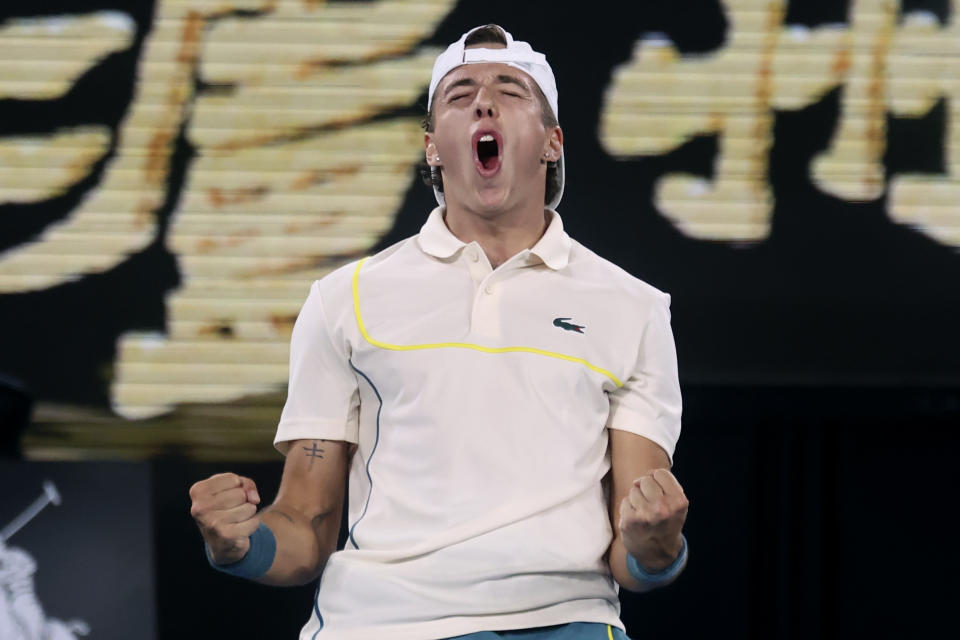 Arthur Cazaux of France celebrates after defeating Holger Rune of Denmark in their second round match at the Australian Open tennis championships at Melbourne Park, Melbourne, Australia, Thursday, Jan. 18, 2024. (AP Photo/Asanka Brendon Ratnayake)