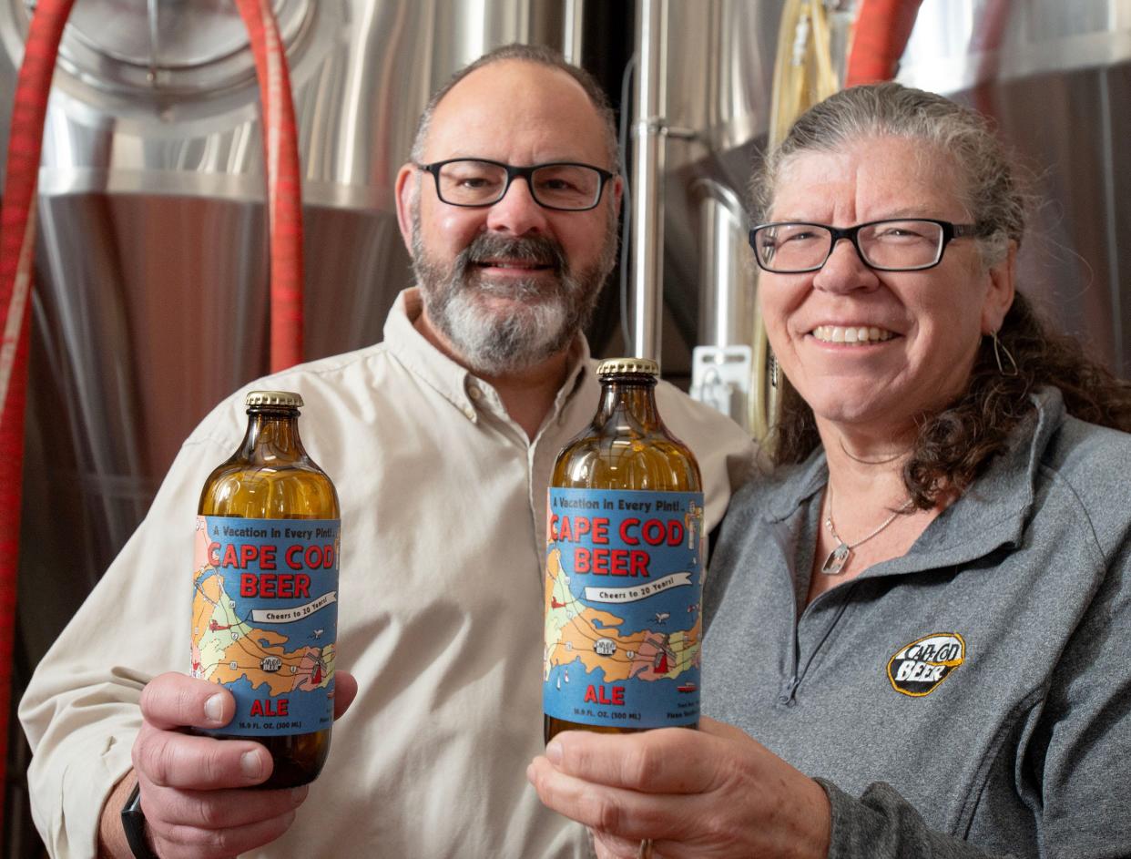 Todd and Beth Marcus show off their anniversary special label bottles available soon to celebrate their 20th year in business.
