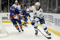 Tampa Bay Lightning defenseman Ryan McDonagh (27) looks to pass as New York Islanders center Mathew Barzal (13) defends during the second period of Game 3 of the NHL hockey Stanley Cup semifinals, Thursday, June 17, 2021, in Uniondale, N.Y. (AP Photo/Frank Franklin II)