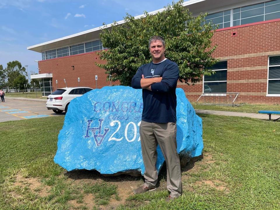 Mitchell Cox, new principal at Hardin Valley Academy, pauses by the Spirit Rock at the school Aug. 2, 2023.