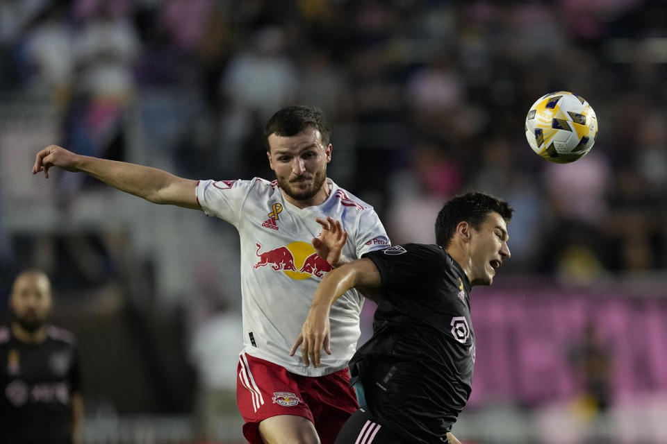 New York Red Bulls defender Thomas Edwards, left, clashes with Inter Miami forward Robbie Robinson during the first half of an MLS soccer match Friday, Sept. 17, 2021, in Fort Lauderdale, Fla. (AP Photo/Rebecca Blackwell)