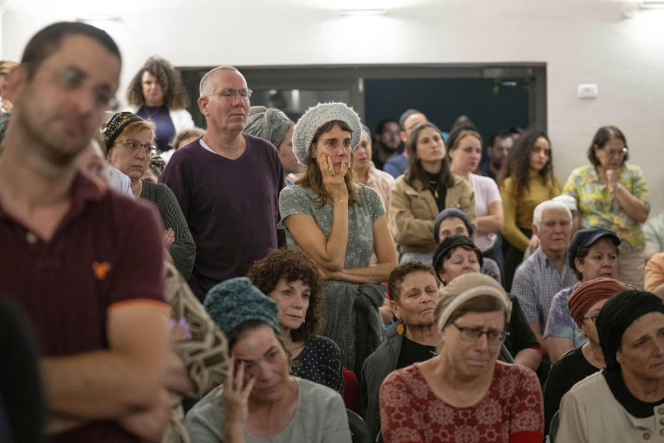 Mourners attend the funeral of Batsheva Nigri, at a cemetery in the West Bank Jewish settlement of Kfar Etzion, Monday, Aug. 21, 2023. Israeli authorities say that a suspected Palestinian attacker has killed an Israeli woman and seriously wounded a man in the incident. (AP Photo/Ohad Zwigenberg)