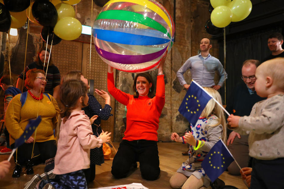 Having a ball: Jo Swinson plays with children at the Battersea Arts Centre in Lavender Hill.