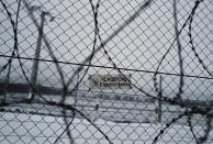 Hungary's border fence with Serbia is seen outside the village of Gyala, Serbia, Thursday, Jan. 13, 2022. Hungary's nationalist prime minister, Viktor Orban, is keen to use the threat of migrants at his country's southern border to give him an advantage in upcoming elections. But the scale of migration pressure claimed by Orban is drawn into question by statistics from neighboring Serbia and the European Union's border agency. (AP Photo/Bela Szandelszky)