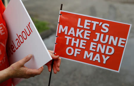 A supporter waits for Jeremy Corbyn, leader of Britain's opposition Labour Party, to arrive at a campaign event in Reading, May 31, 2017. REUTERS/Peter Nicholls