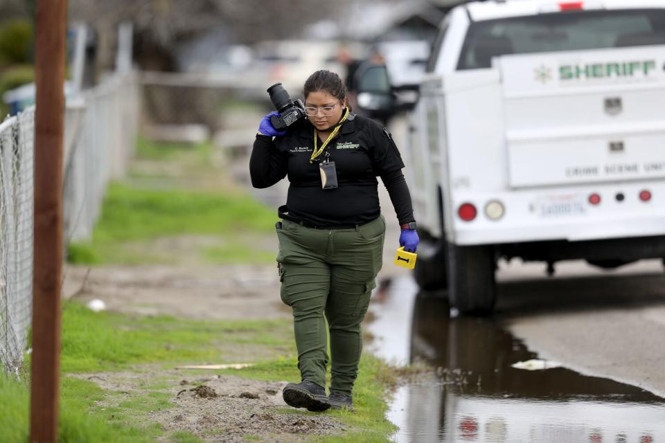 Tulare County Sheriff crime unit investigates the scene in Goshen.